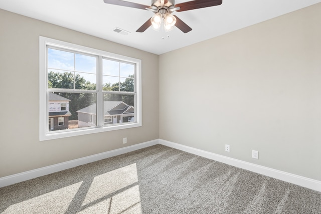 unfurnished room with carpet flooring and ceiling fan