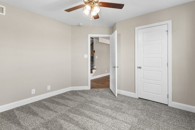 unfurnished bedroom featuring carpet floors and ceiling fan