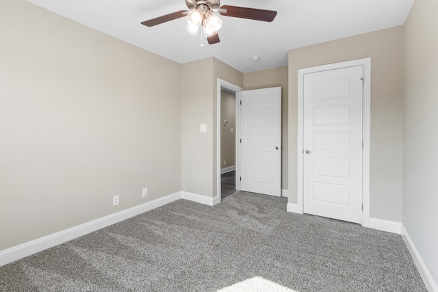 unfurnished bedroom with ceiling fan and carpet floors