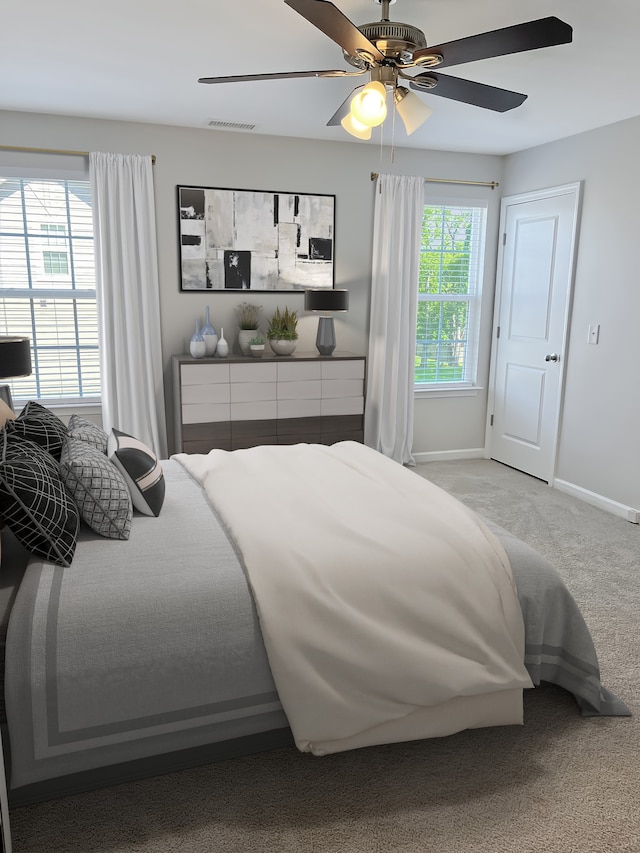 carpeted bedroom with ceiling fan