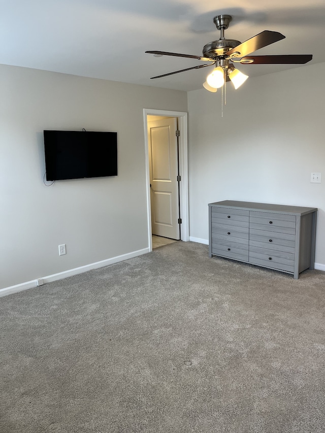 unfurnished bedroom with ceiling fan and carpet floors