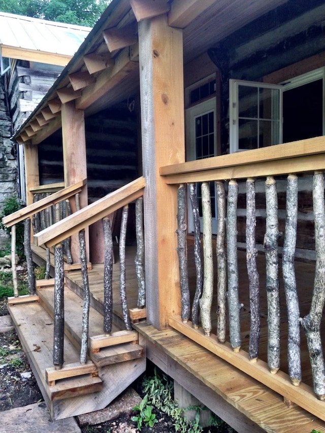 wooden terrace featuring an exterior structure and an outdoor structure