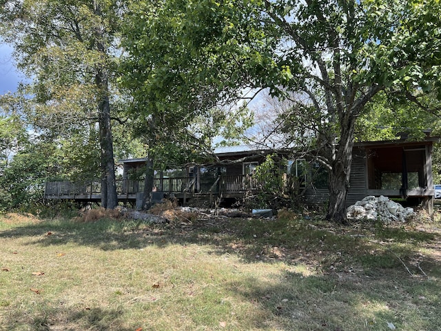 view of yard with a wooden deck