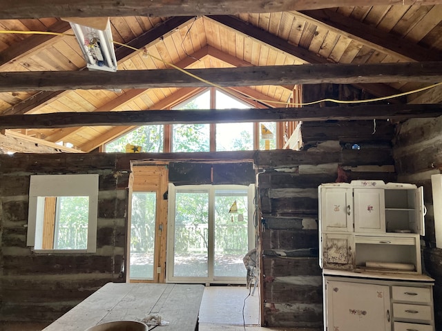 interior space with wood ceiling and vaulted ceiling with beams