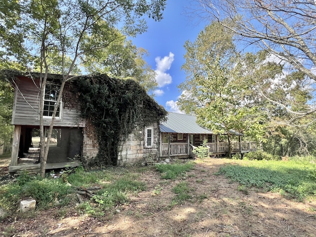 exterior space featuring metal roof