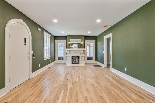 unfurnished living room featuring light hardwood / wood-style flooring