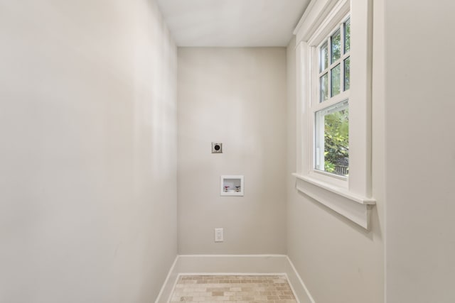 washroom with tile patterned floors, electric dryer hookup, a healthy amount of sunlight, and hookup for a washing machine