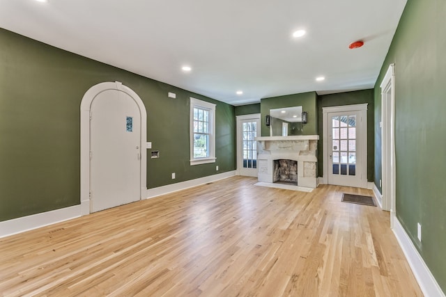 unfurnished living room featuring light wood-type flooring