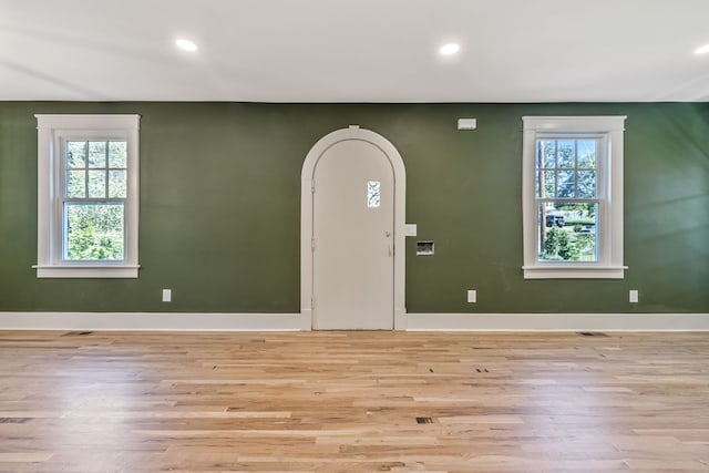 entrance foyer with light hardwood / wood-style floors and plenty of natural light