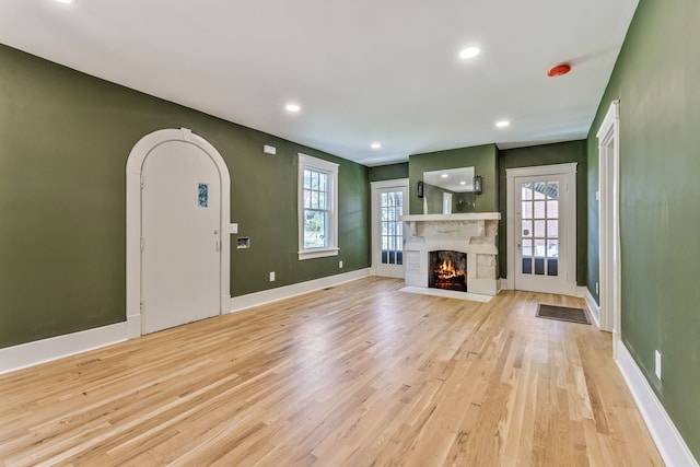 unfurnished living room featuring light wood-type flooring