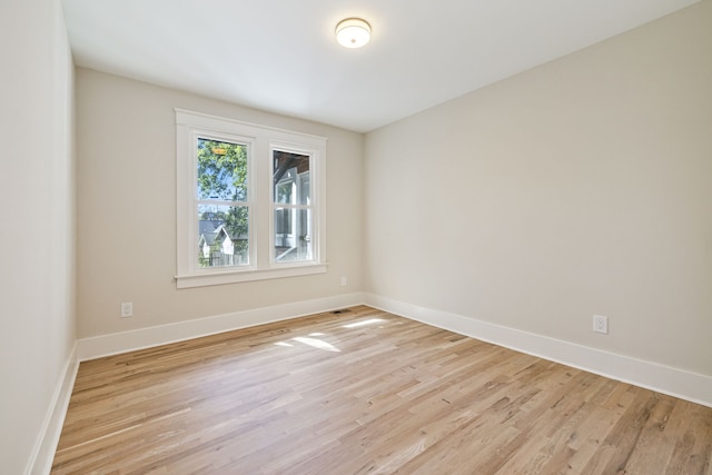 spare room featuring light wood-type flooring