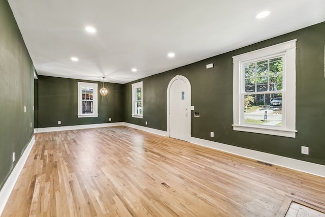 spare room featuring light wood-type flooring