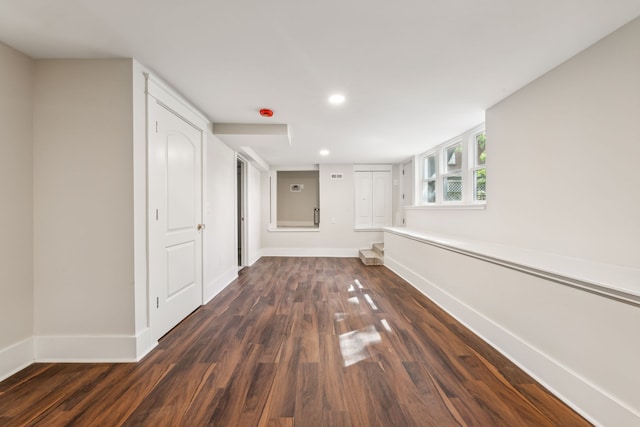 hallway featuring dark hardwood / wood-style floors