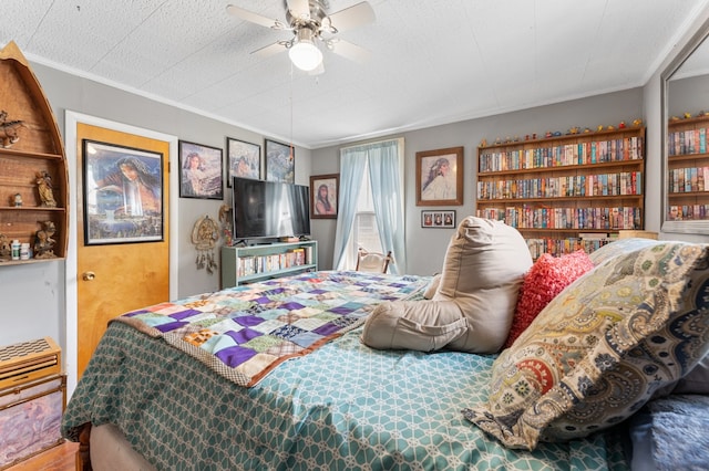 bedroom with ceiling fan and crown molding