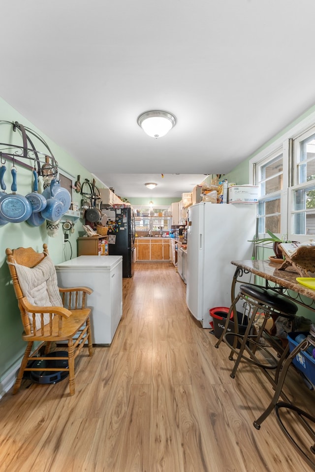 interior space with light hardwood / wood-style flooring