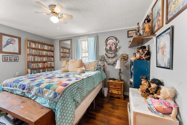 bedroom with ornamental molding, dark hardwood / wood-style floors, ceiling fan, and a textured ceiling