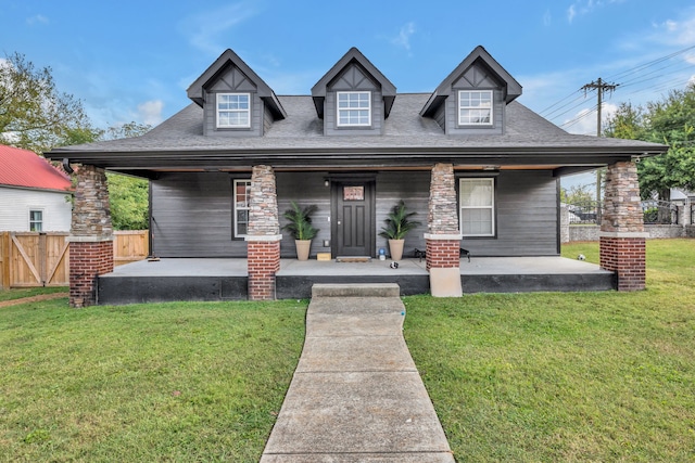 view of front of house featuring a front yard and covered porch