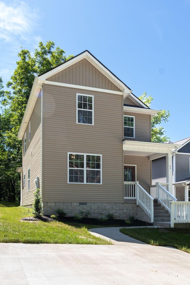 view of front of home with a front lawn and covered porch