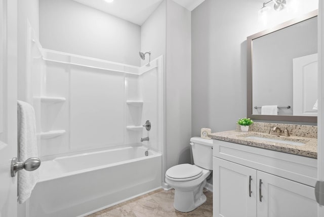 bathroom featuring vanity, bathing tub / shower combination, and toilet