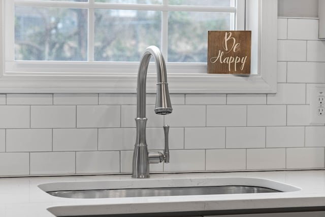 room details featuring a sink and light countertops