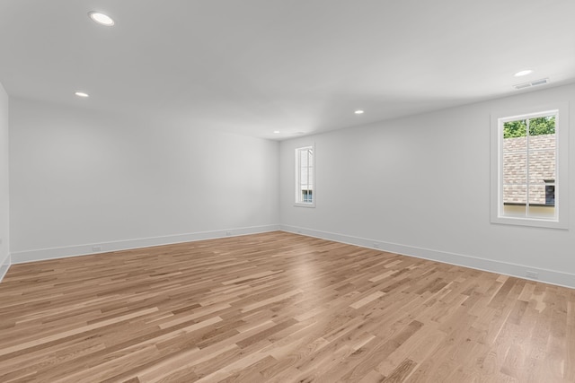 unfurnished room featuring light hardwood / wood-style floors