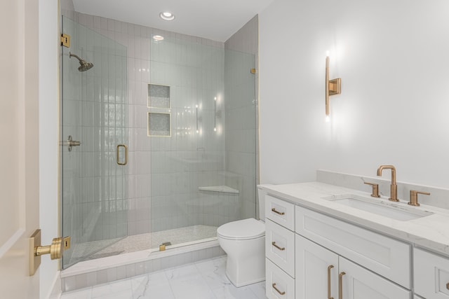 bathroom featuring tile flooring, an enclosed shower, vanity, and toilet