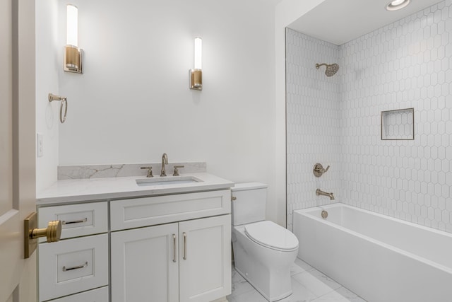 full bathroom with tiled shower / bath, vanity, toilet, and tile flooring