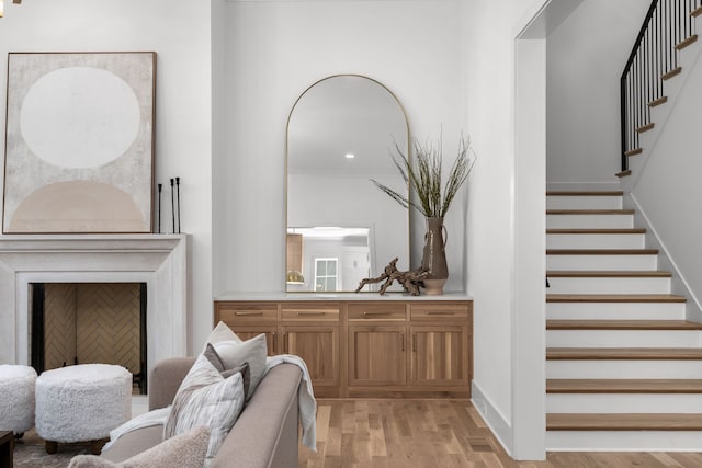 interior space featuring ornamental molding and light hardwood / wood-style flooring