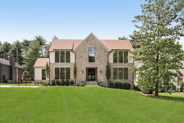 view of front of home with a front lawn