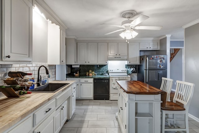 kitchen with tasteful backsplash, butcher block countertops, light tile flooring, black appliances, and sink