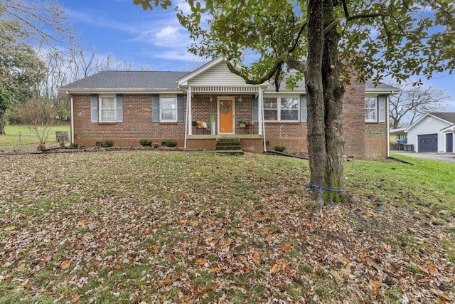 view of front of house with a front yard and a garage