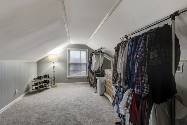 spacious closet with vaulted ceiling and carpet