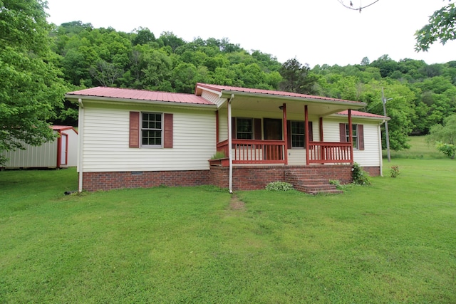 view of front of home featuring a front yard and a porch