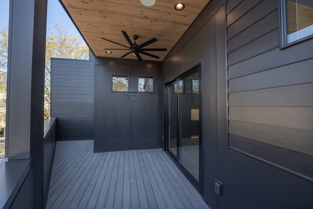 wooden terrace featuring ceiling fan