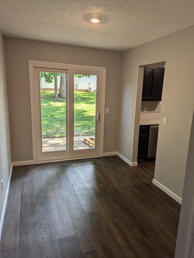 entryway featuring dark hardwood / wood-style floors and a textured ceiling