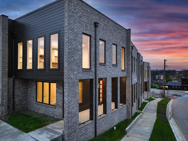 view of property exterior at dusk