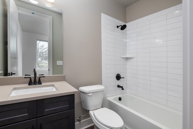 full bathroom with vanity, toilet, and tiled shower / bath combo