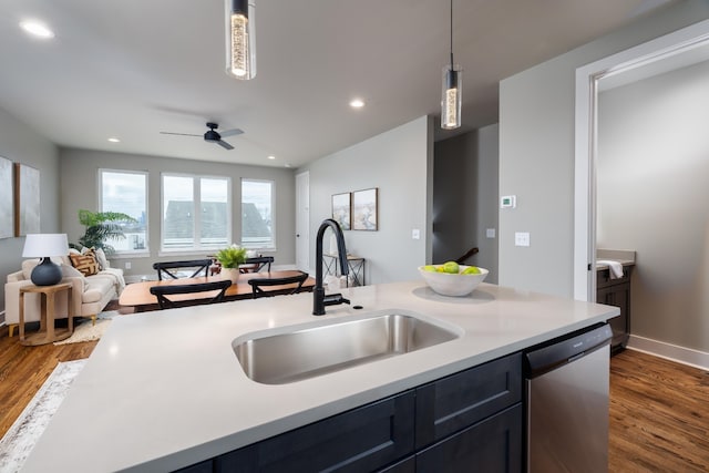 kitchen featuring hanging light fixtures, ceiling fan, dishwasher, and dark hardwood / wood-style flooring