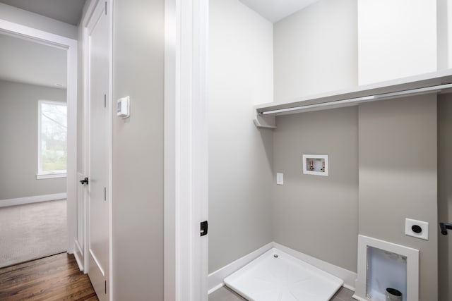 laundry area featuring electric dryer hookup, dark wood-type flooring, and washer hookup