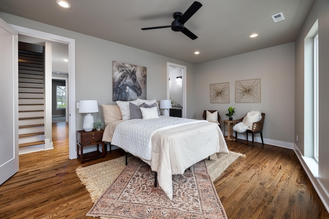 bedroom with ceiling fan and hardwood / wood-style flooring