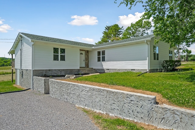 ranch-style house with a front yard