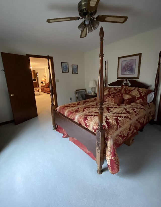 bedroom featuring ceiling fan and light carpet