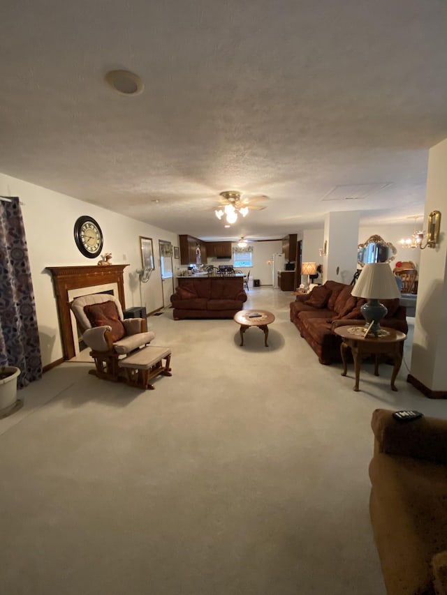 bedroom featuring a fireplace, carpet flooring, and a textured ceiling