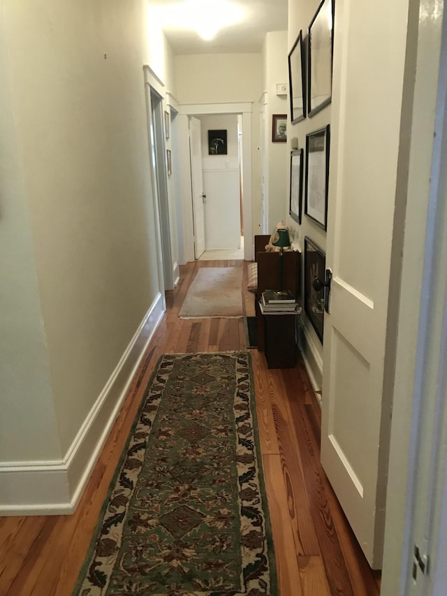 hallway featuring hardwood / wood-style floors