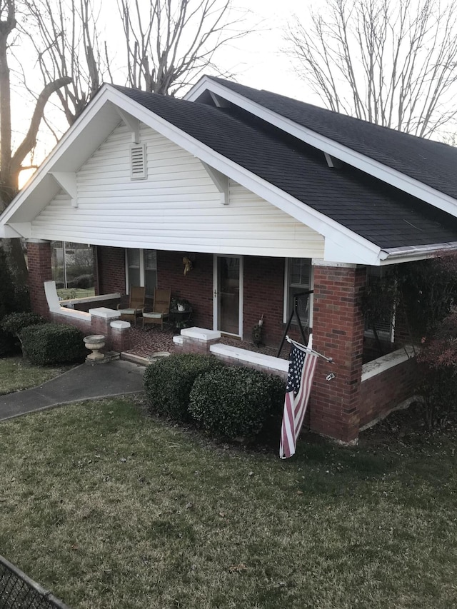 rear view of house with a lawn