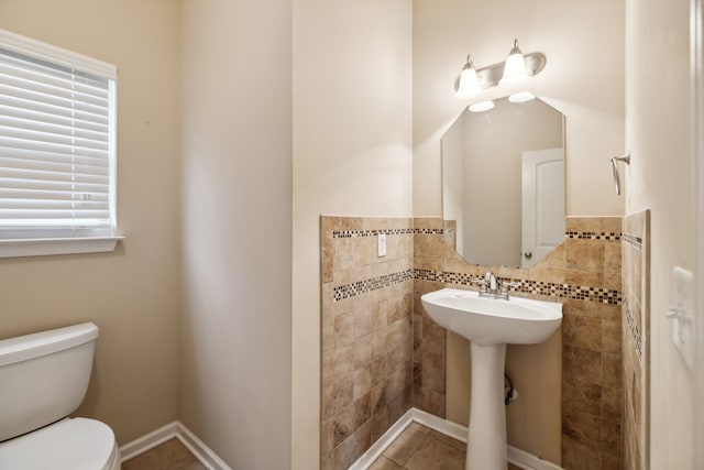 bathroom featuring tile patterned flooring and toilet