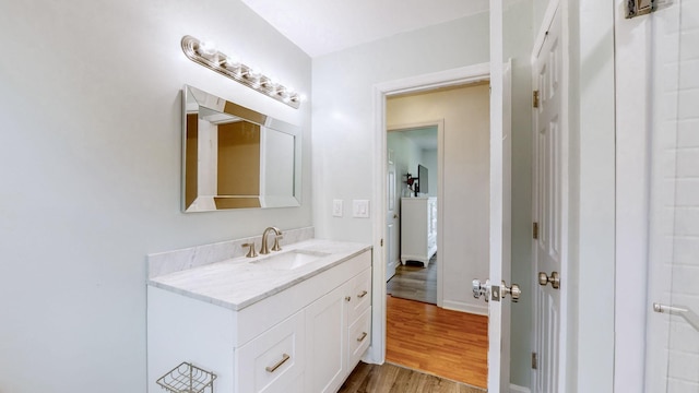 bathroom featuring vanity and hardwood / wood-style floors