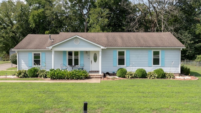 ranch-style house with a front lawn