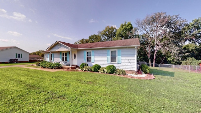 single story home featuring a front lawn