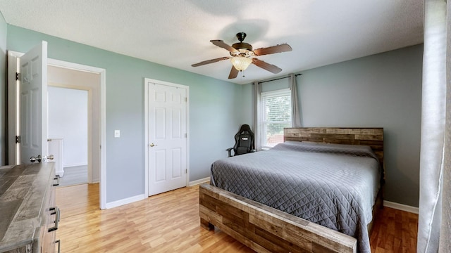 bedroom featuring ceiling fan and light wood-type flooring